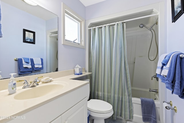 full bathroom featuring vanity, shower / bath combination with curtain, and toilet