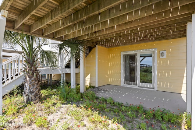 entrance to property with a patio