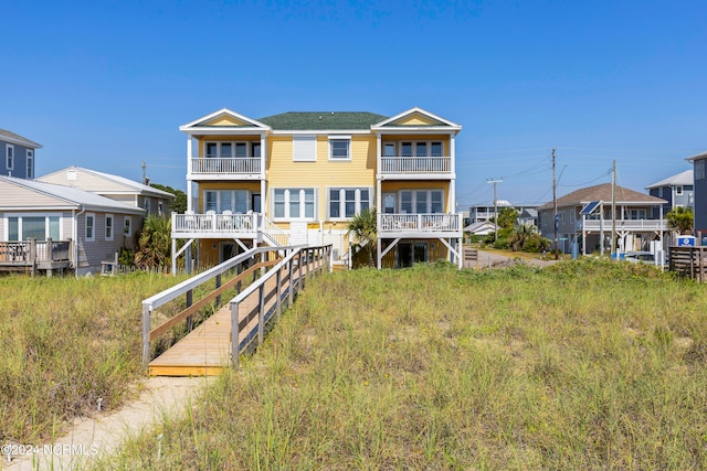 back of property with a balcony