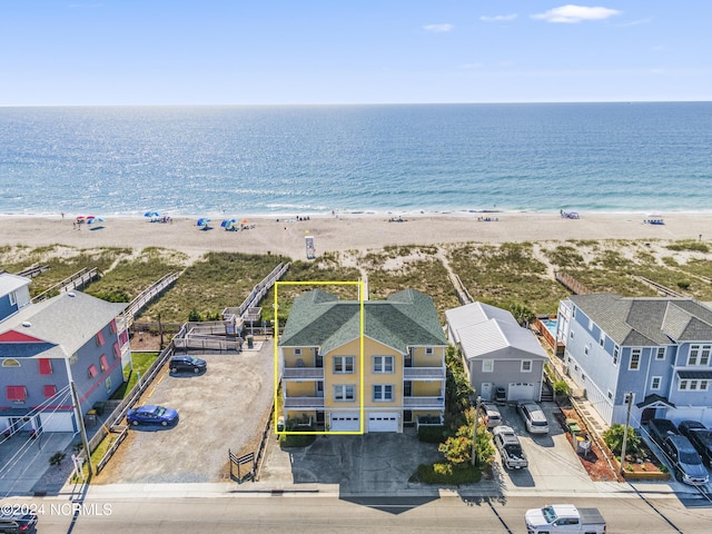 bird's eye view with a view of the beach and a water view