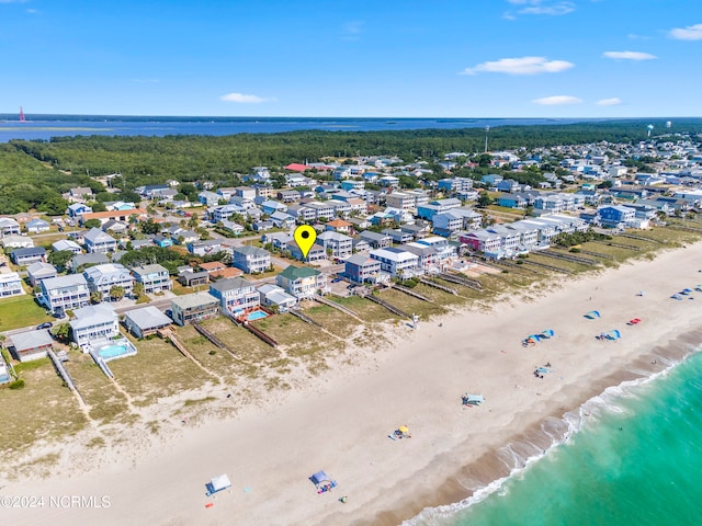 bird's eye view featuring a view of the beach and a water view