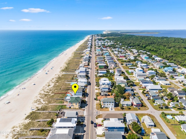 drone / aerial view featuring a water view and a view of the beach