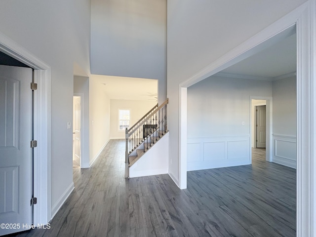 entryway featuring hardwood / wood-style floors and crown molding