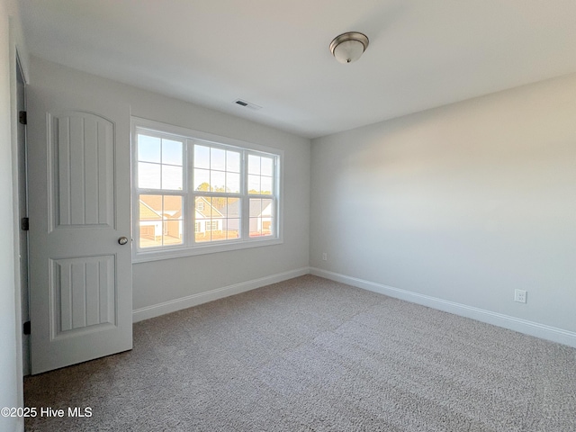 spare room featuring carpet floors