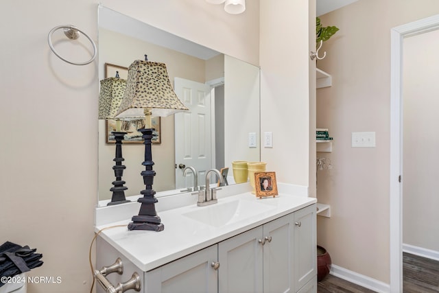 bathroom featuring vanity and hardwood / wood-style flooring