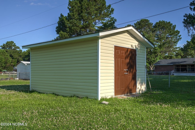 view of outdoor structure with a yard