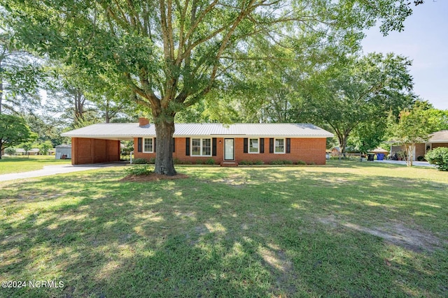 ranch-style house with a front lawn and a carport