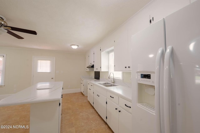 kitchen with white refrigerator with ice dispenser, white cabinetry, crown molding, and sink