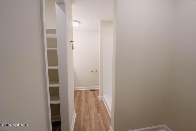 hall with light hardwood / wood-style floors