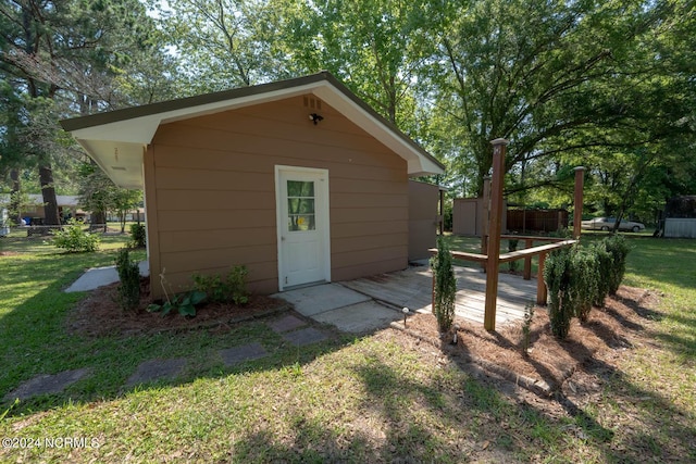 view of outdoor structure featuring a lawn