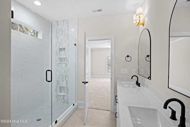 full bathroom featuring a wealth of natural light, visible vents, and a sink