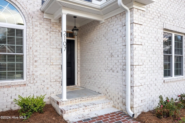 entrance to property with brick siding