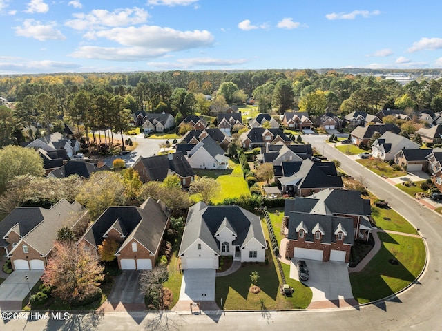 birds eye view of property with a residential view