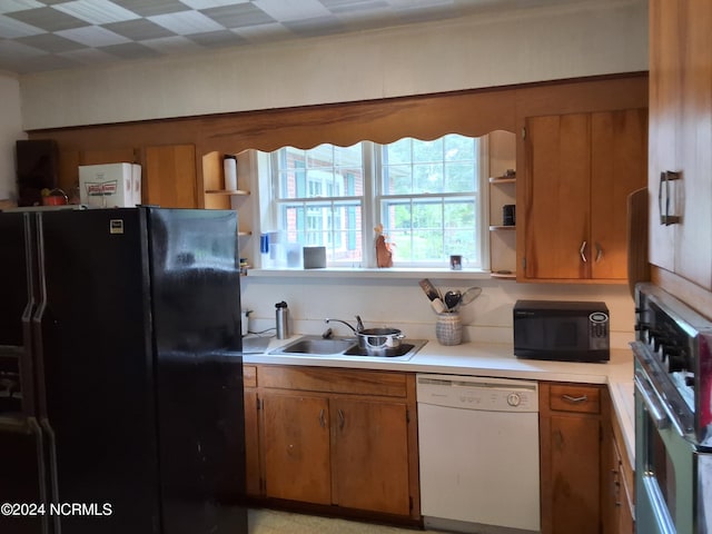 kitchen featuring black appliances and sink