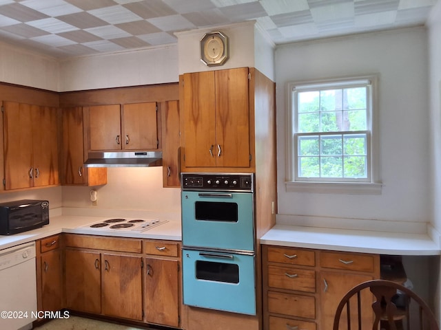 kitchen with white appliances and crown molding