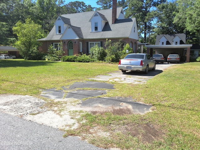 cape cod-style house with a carport and a front yard