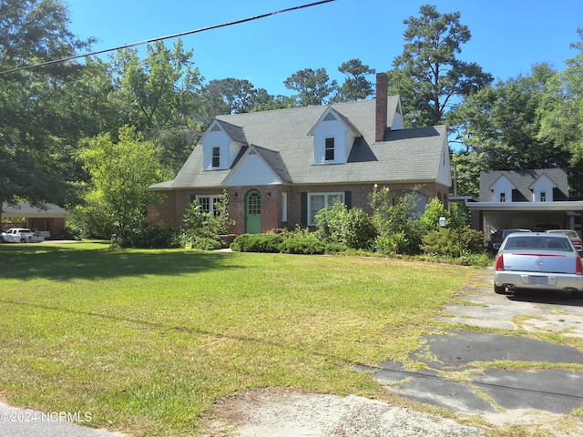 cape cod house with a front lawn