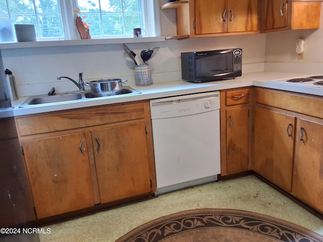 kitchen with sink and white appliances