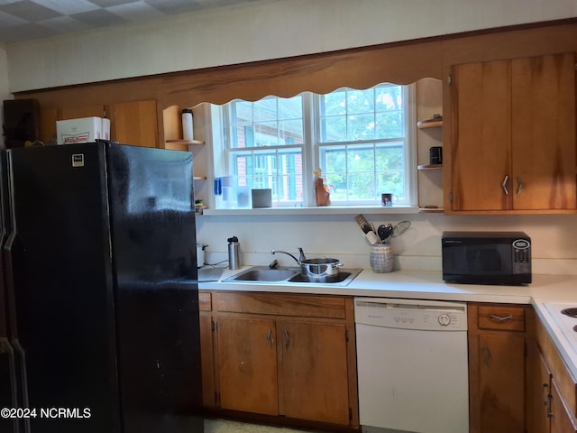 kitchen featuring sink and black appliances