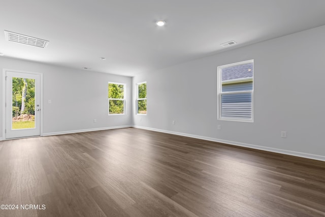 empty room featuring dark hardwood / wood-style flooring