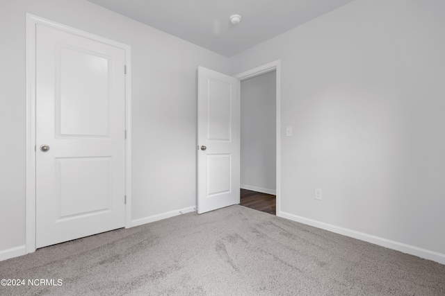 unfurnished bedroom with carpet flooring