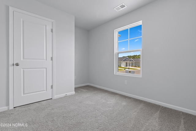 empty room featuring carpet floors