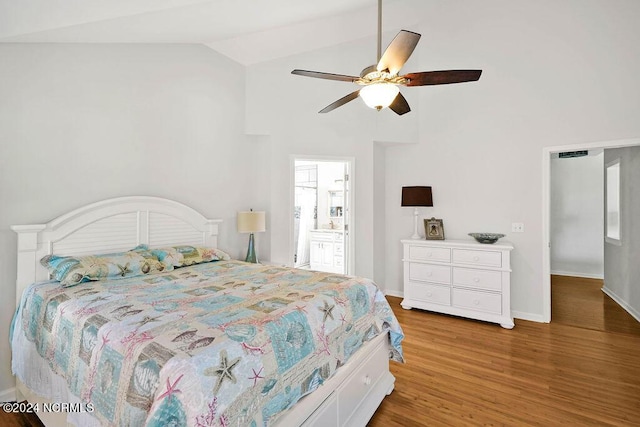 bedroom featuring lofted ceiling, a ceiling fan, baseboards, and wood finished floors