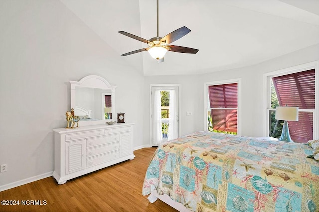 bedroom featuring access to outside, baseboards, lofted ceiling, and light wood finished floors