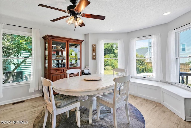 dining room with recessed lighting, visible vents, a ceiling fan, a textured ceiling, and light wood-type flooring