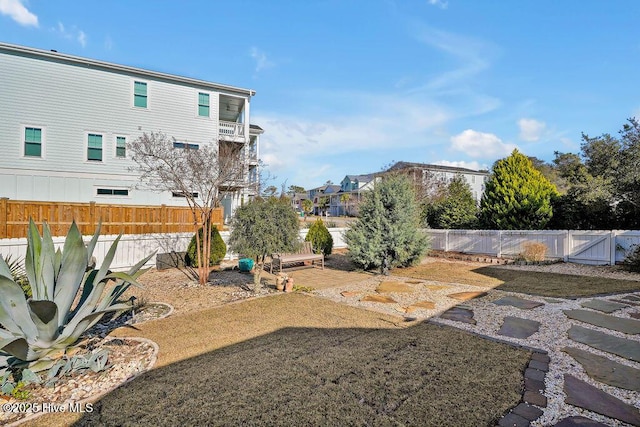 view of yard featuring a patio area and a fenced backyard