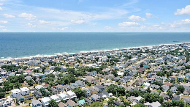 drone / aerial view featuring a residential view and a water view