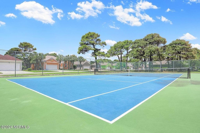 view of sport court featuring fence