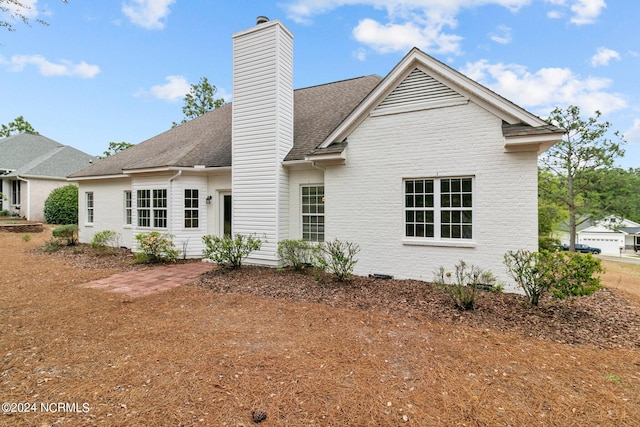 rear view of house featuring a patio