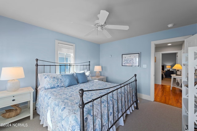 bedroom with ceiling fan and carpet floors