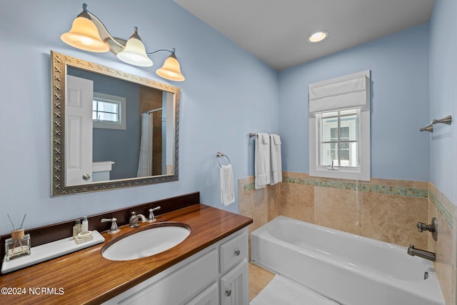 bathroom featuring vanity and a bathtub