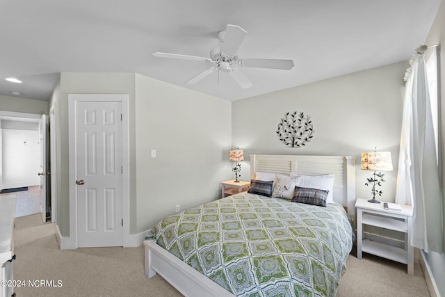 carpeted bedroom featuring ceiling fan