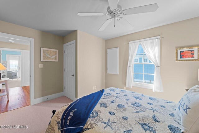 carpeted bedroom with ceiling fan