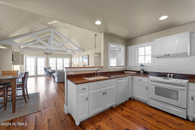 kitchen featuring white appliances, sink, white cabinetry, kitchen peninsula, and extractor fan