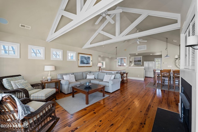 living room with ceiling fan, hardwood / wood-style floors, and a healthy amount of sunlight