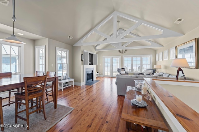 interior space featuring hardwood / wood-style floors and vaulted ceiling