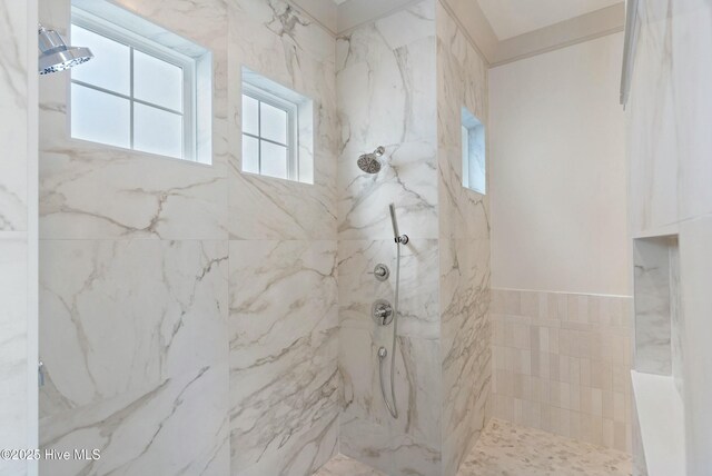 bathroom featuring tiled shower