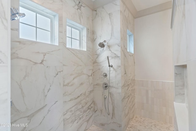 full bath featuring a marble finish shower