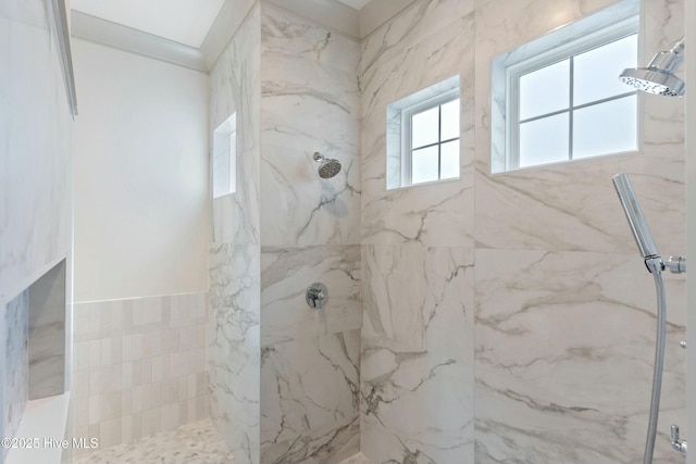 full bathroom with a marble finish shower