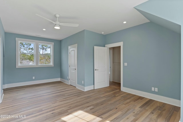 unfurnished bedroom featuring a ceiling fan, baseboards, wood finished floors, and recessed lighting