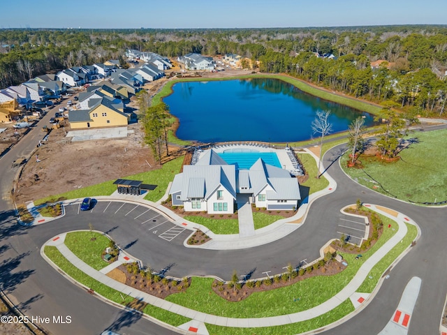 birds eye view of property featuring a water view and a residential view