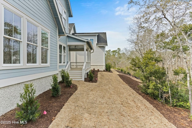 view of property exterior featuring a porch