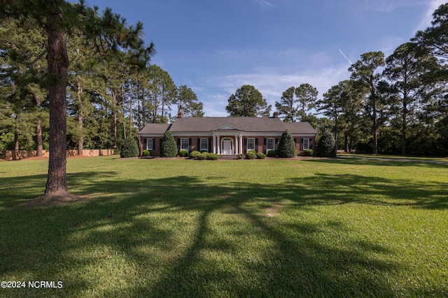 ranch-style house with a front yard