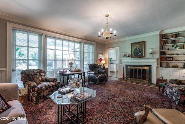 living room featuring crown molding and a chandelier