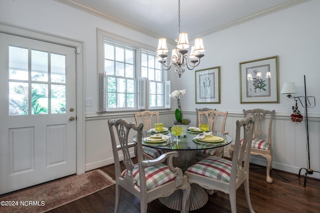 dining area featuring dark hardwood / wood-style flooring, a healthy amount of sunlight, and ornamental molding