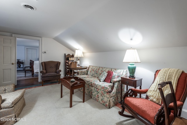 living room featuring hardwood / wood-style floors and lofted ceiling